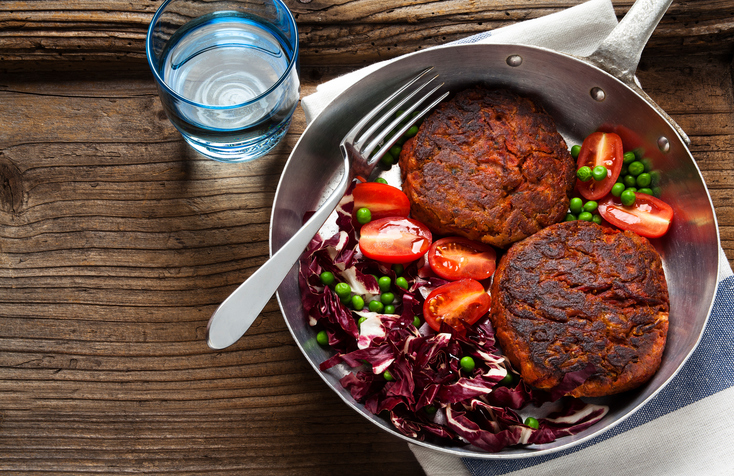 two Vegan Burgers and salad in a frying pan healthy habits
