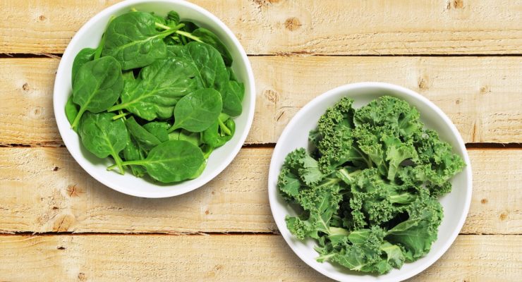 a bowl of spinach and a bowl of kale