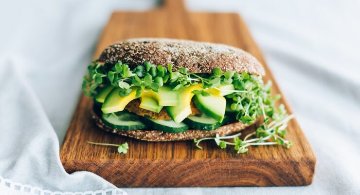 avocado on healthy bread with greens