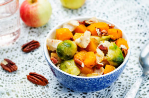 Brussels sprouts pumpkin apple chicken stew. toning. selective focus