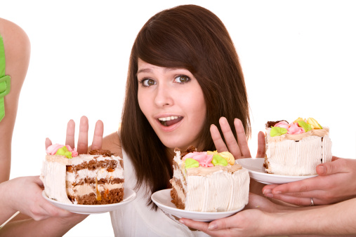 woman declining cake