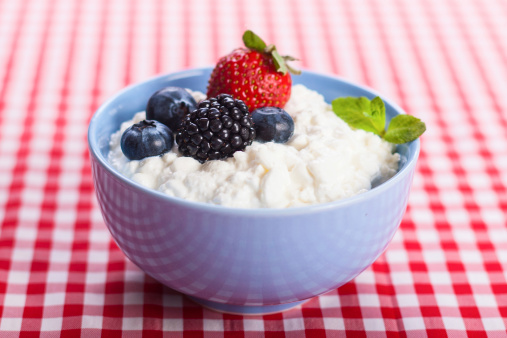 bowl of cottage cheese with blueberries, blackberries and strawberries