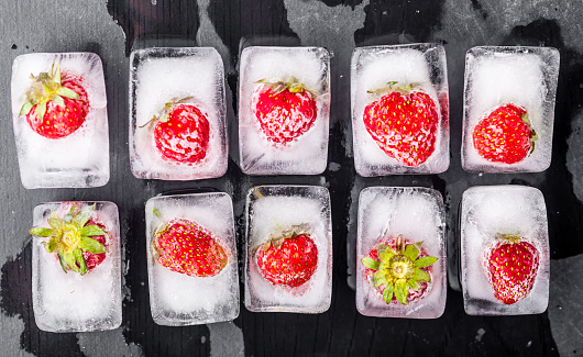 frozen strawberries in ice cubes