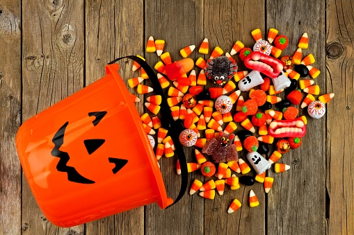 Halloween Candies spilling out of a bucket