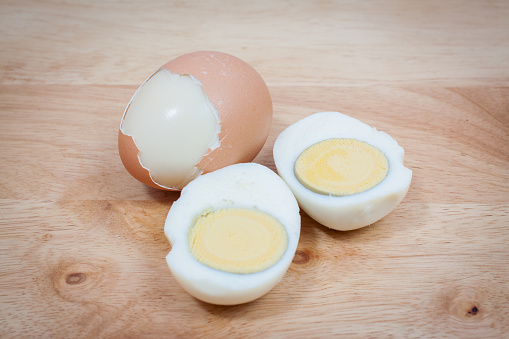 Boiled eggs on wooden background