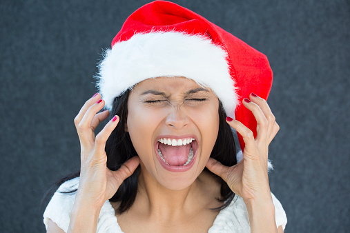 woman with santa hat yelling