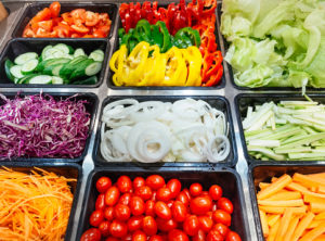 salad bar options including tomatoes, onions, cabbage, celery, carrots, peppers, and cucumber