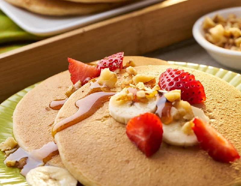 pancakes with nuts, berries and syrup breakfast food swaps