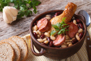 beans, sausage and chicken in a crock