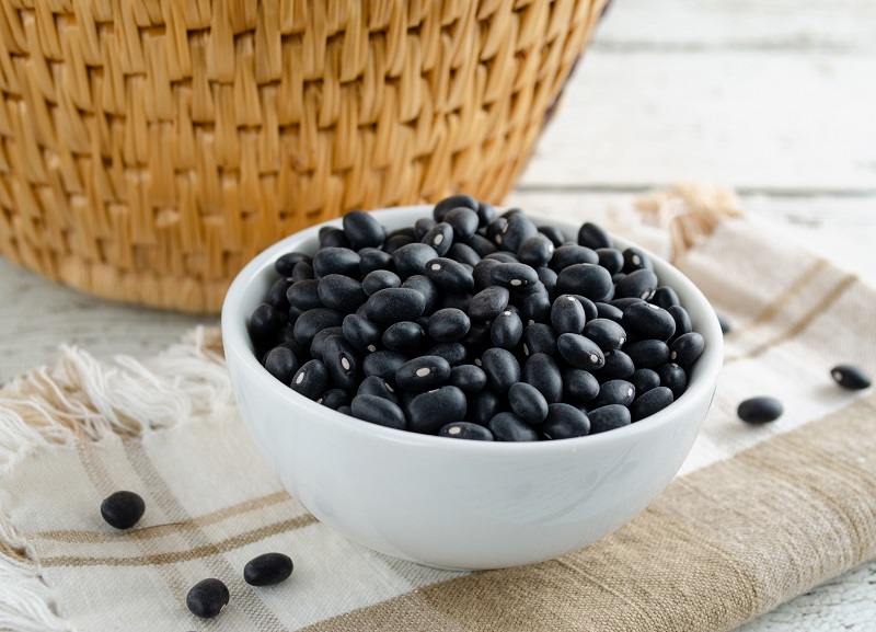 uncooked black beans in a bowl