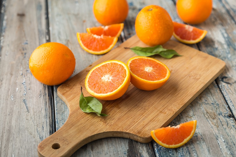 sliced oranges on a cutting board