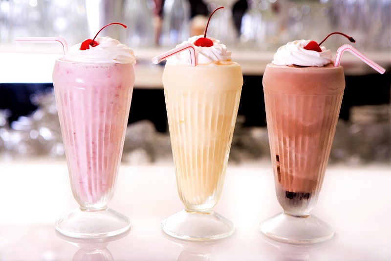 Strawberry, vanilla and chocolate milkshakes.