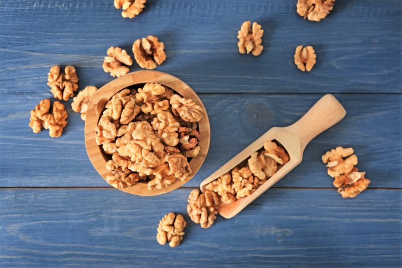 walnuts in a bowl with a scoop are healthy superfoods