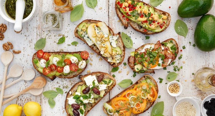 open faced sandwiches with different healthy toppings