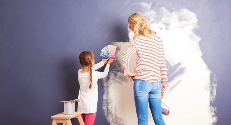 woman and child painting walls