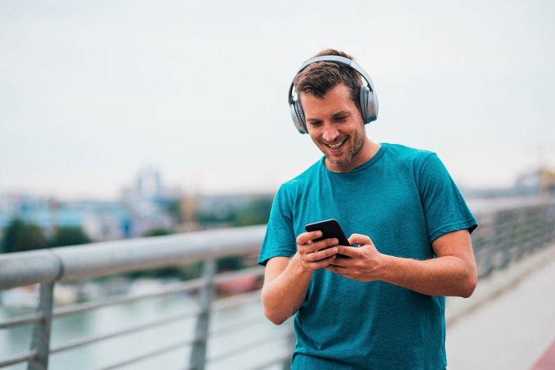 Man listens to music while walking