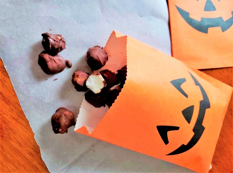 chocolate covered peppermint gems in Halloween candy bag