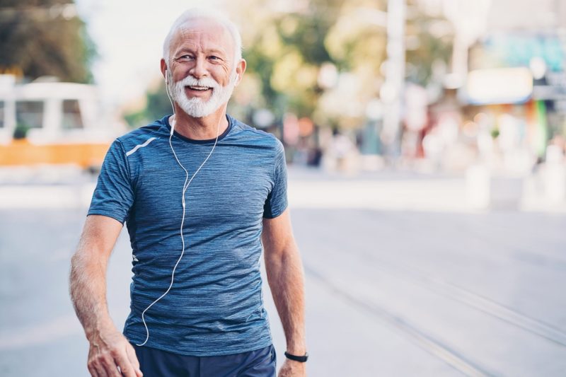 Older man walking for exercise to burn more calories