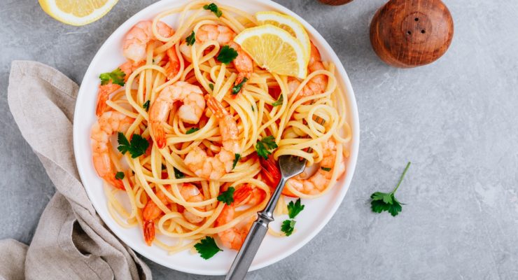healthy pasta recipes with shrimp, lemon, and cilantro as garnish 