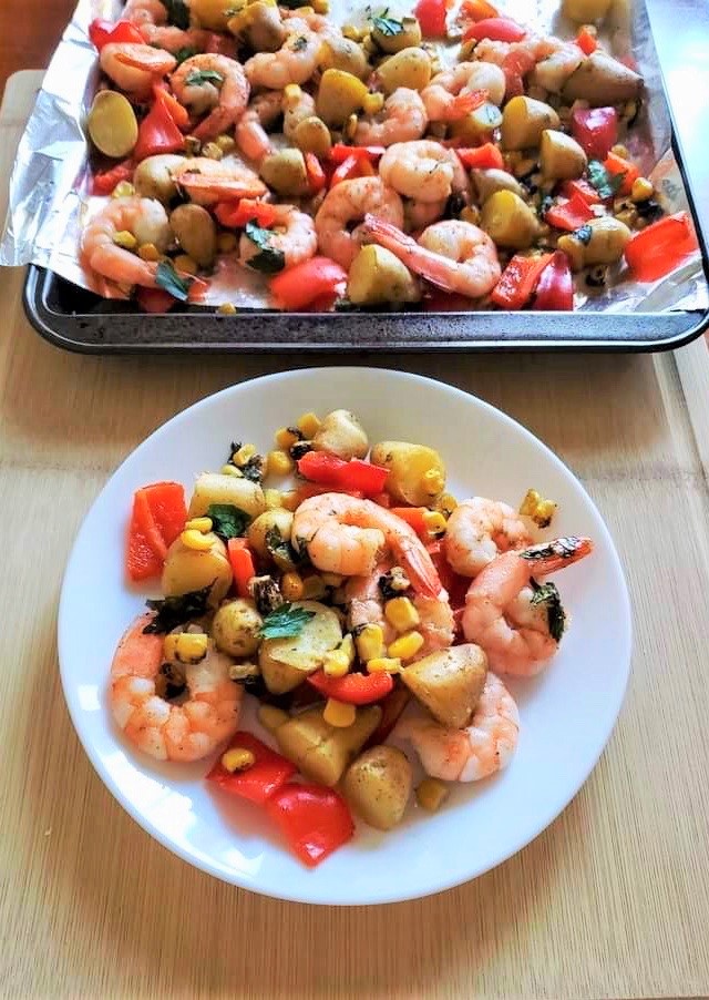 cajun shrimp, potato and vegetable boil served on a plate