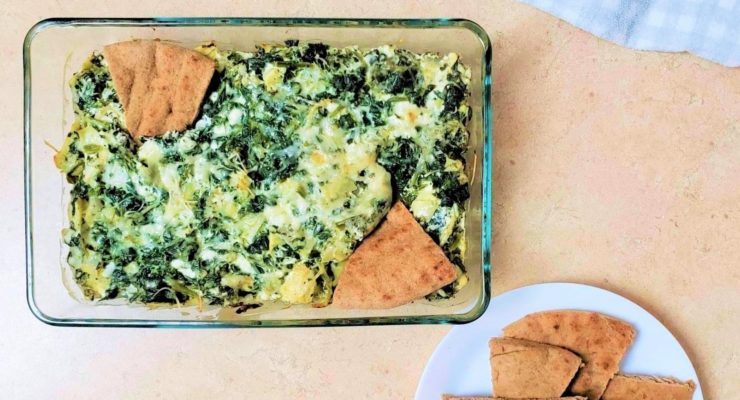 baked hot  spinach artichoke dip with a side of chips