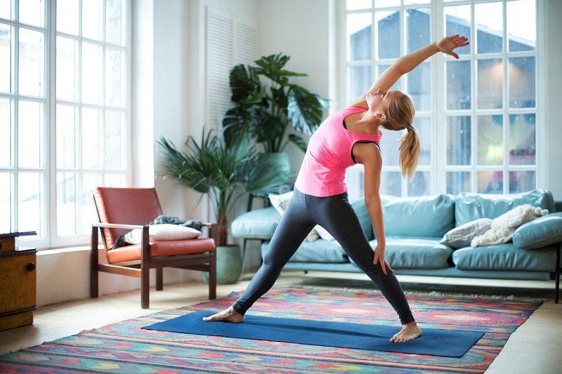 woman working out in her living room