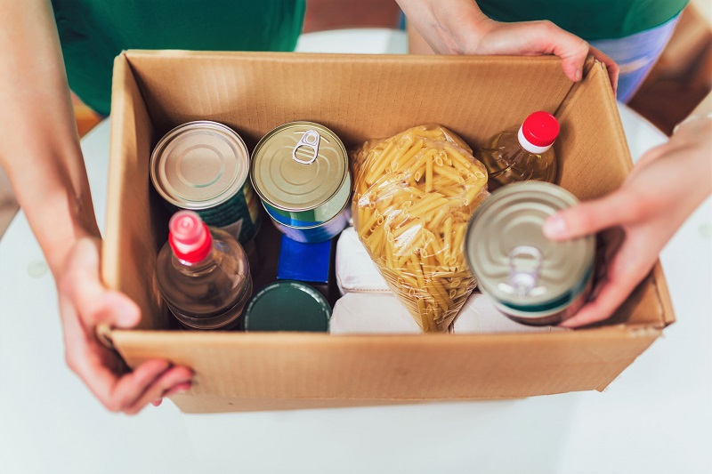 a box of canned goods and pantry items