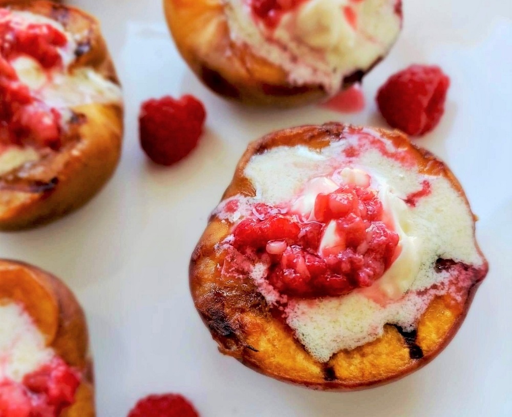 Grilled Peach Melba with mascarpone cheese and raspberries