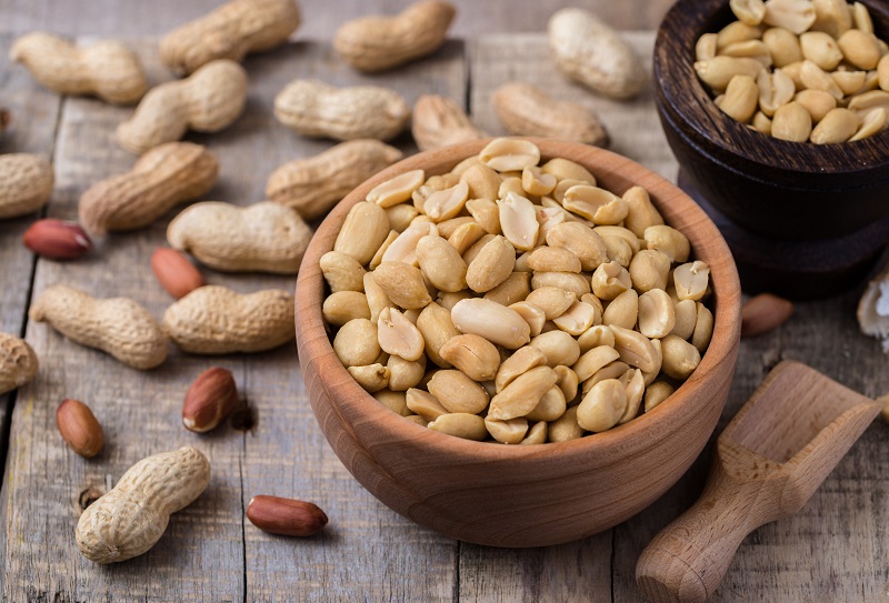 Peanuts in small wooden bowl