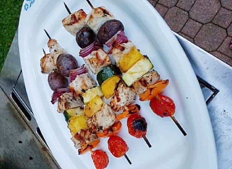 Rainbow Vegetable Skewers on a plate on a grill