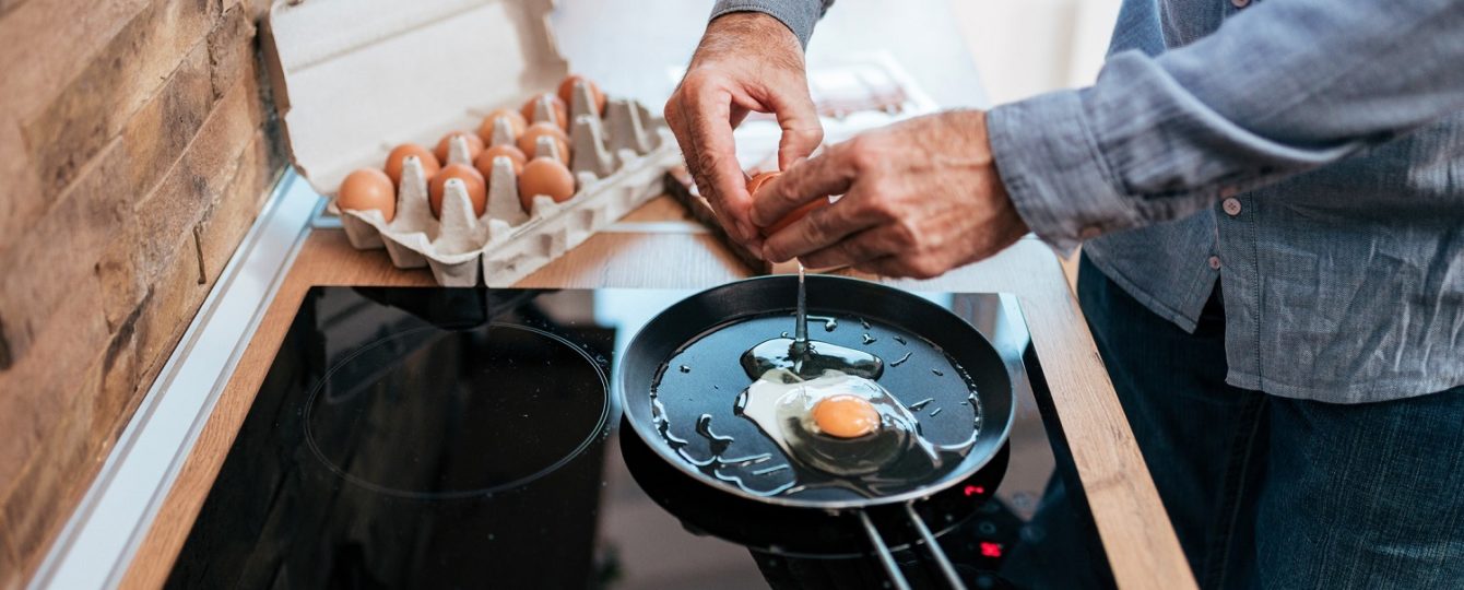 Man cooking eggs