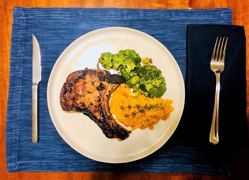 Bone pork chops, mashed sweet potatoes and roasted broccoli