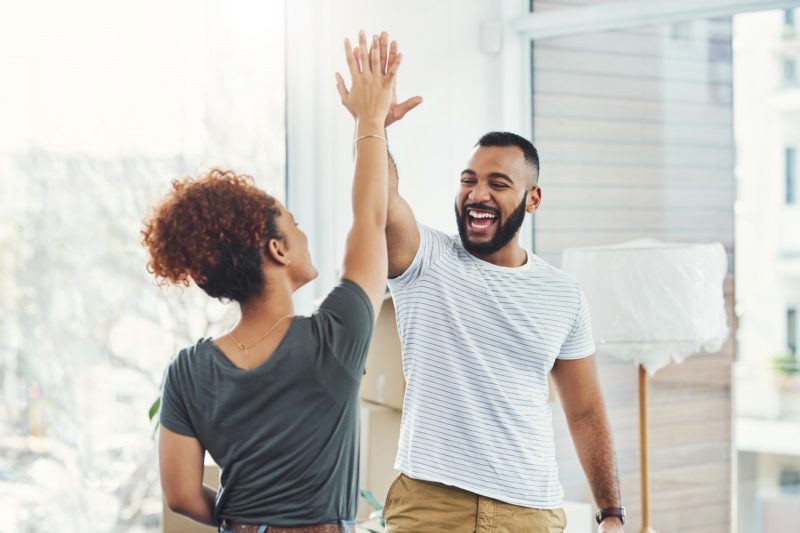couple giving a high five, weight loss partner