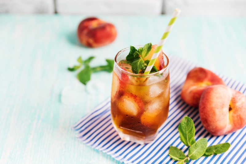 peach iced tea in a glass