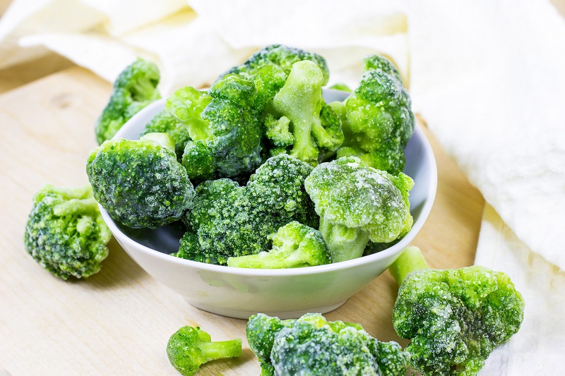 frozen broccoli in a white bowl
