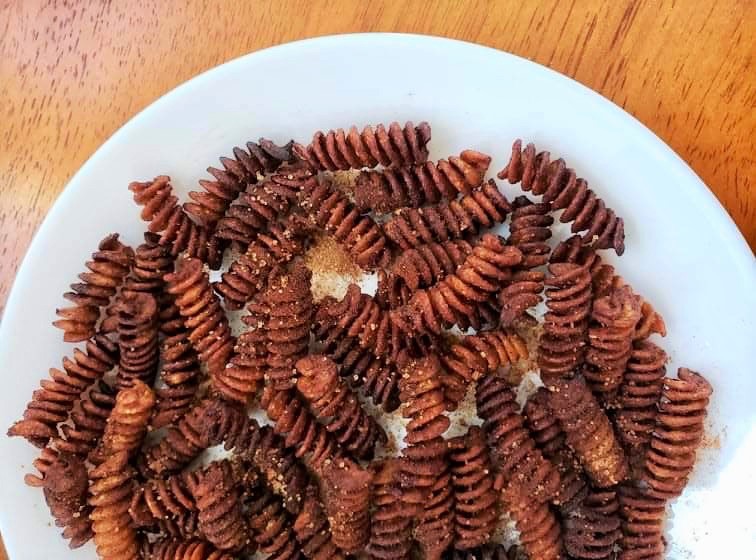 Air Fryer Churro Pasta Chips with cinnamon sugar on a plate