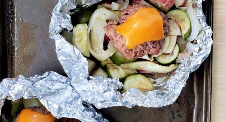 Grilled Foil Packet Cheeseburger with potatoes, zucchini and onions