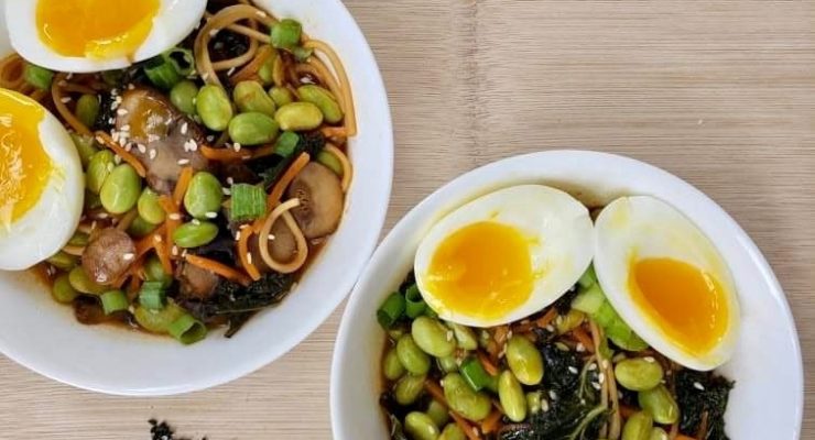 Homemade ramen noodle bowls with eggs and edamame for a protein boost