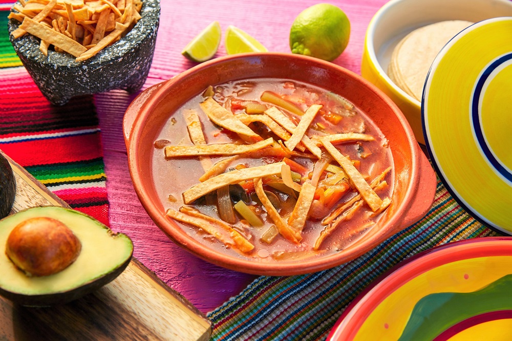 Instant Pot Chicken Tortilla Soup with avocado, limes and tortilla strips