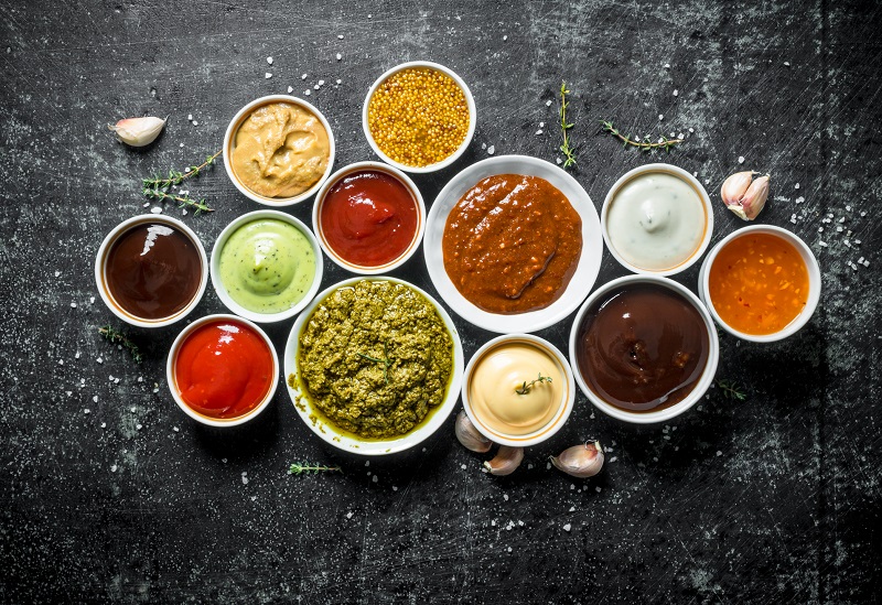 different sauces and condiments in bowls.