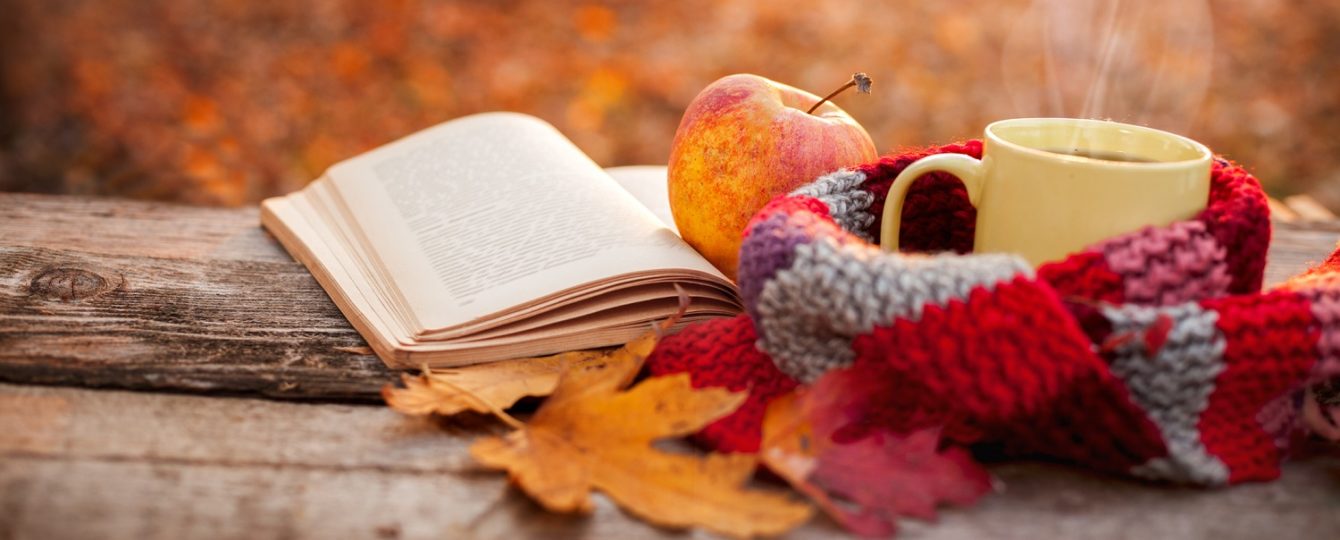 A fall scarf, an apple, some spiced tea, and a good book make for mindful self-care