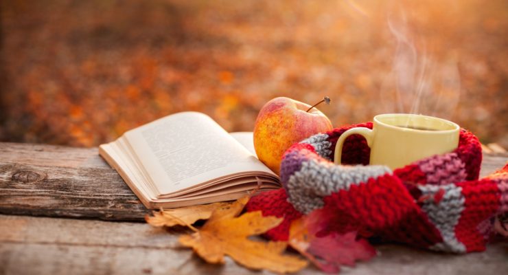 A fall scarf, an apple, some spiced tea, and a good book make for mindful self-care