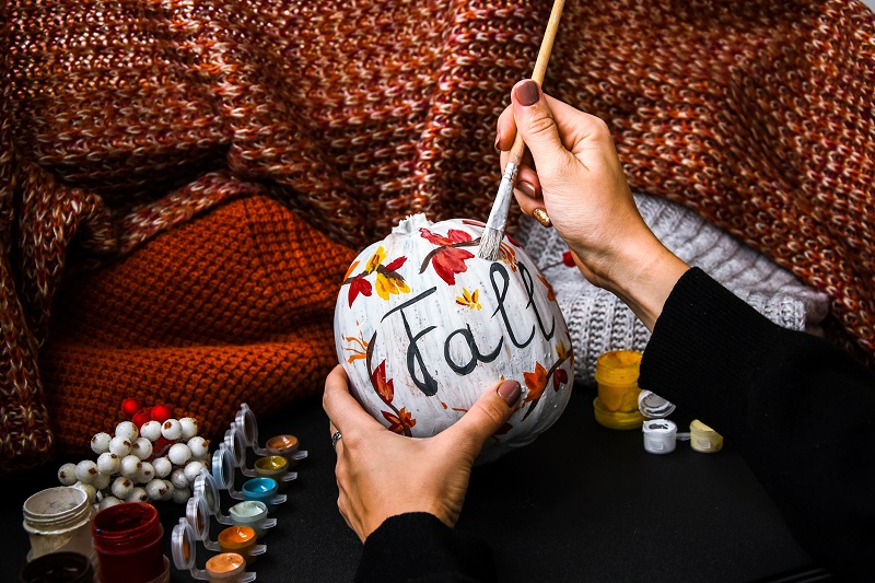 Practice fall self-care through painting gourds or making other autumn decorations