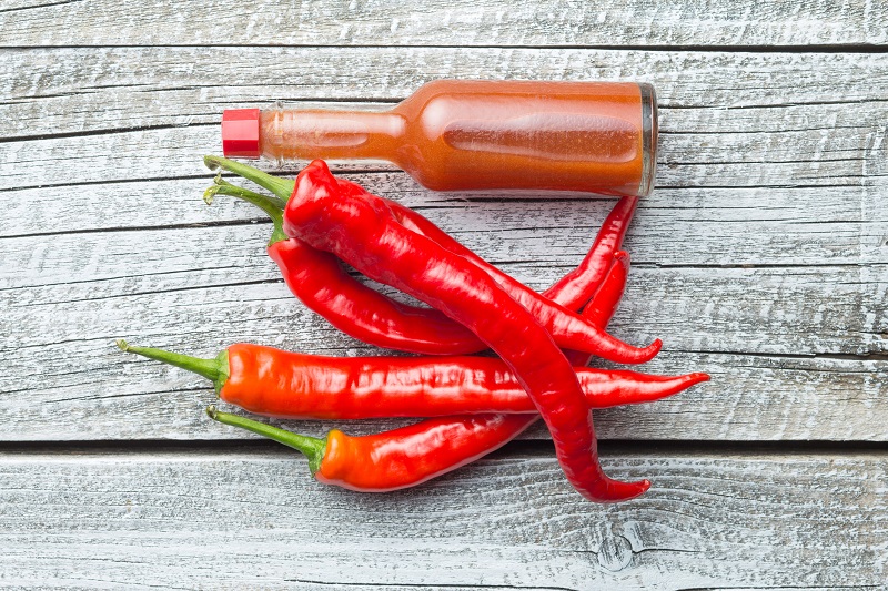 Spicy Red chili peppers and hot sauce