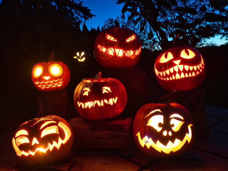 Pumpkin carving jack o’lanterns into faces from spooky to goofy