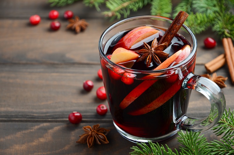Glass of mulled wine infused with fruit and spices