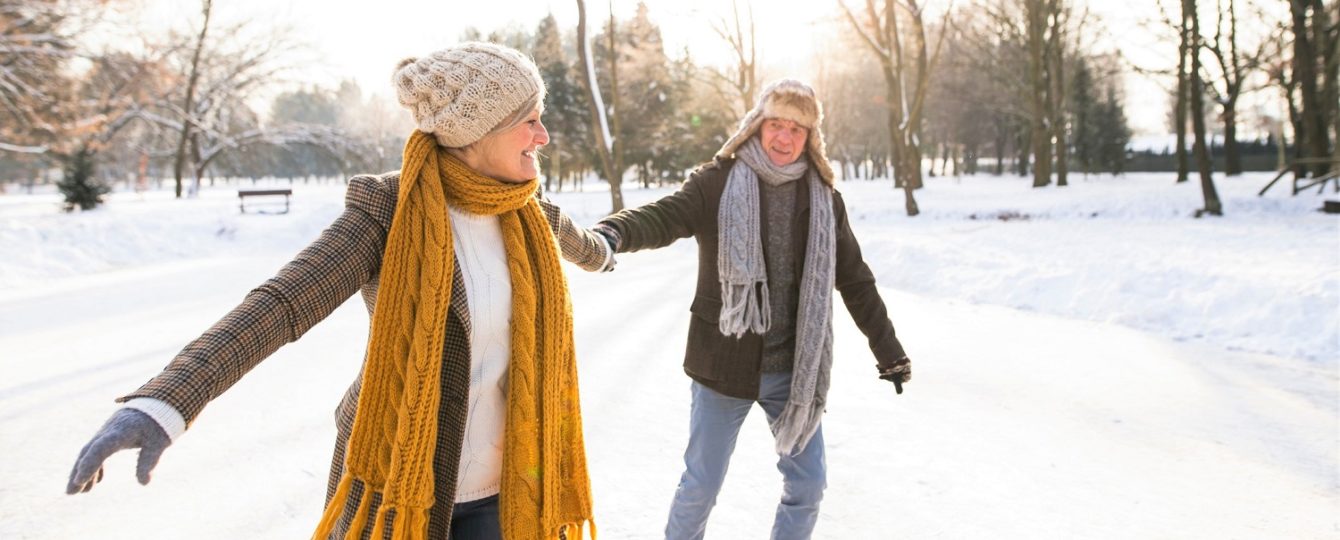 couple ice skating outside during winter