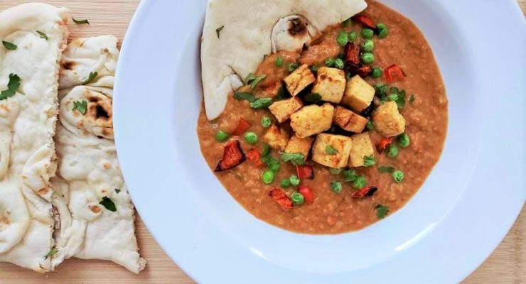 Bowl of tofu tikka masala with naan from the air fryer