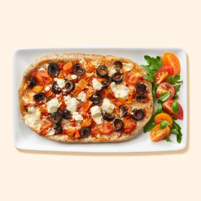 A Mediterranean pizza on a plate