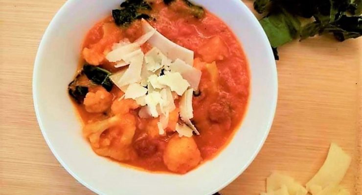 Easy Tomato Vegetable Soup Topped with Parmesan Cheese